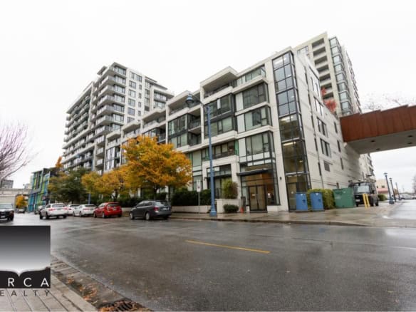 Modern mixed-use residential and commercial building in Vancouver, BC with contemporary architecture, vibrant urban setting, and convenient parking options.