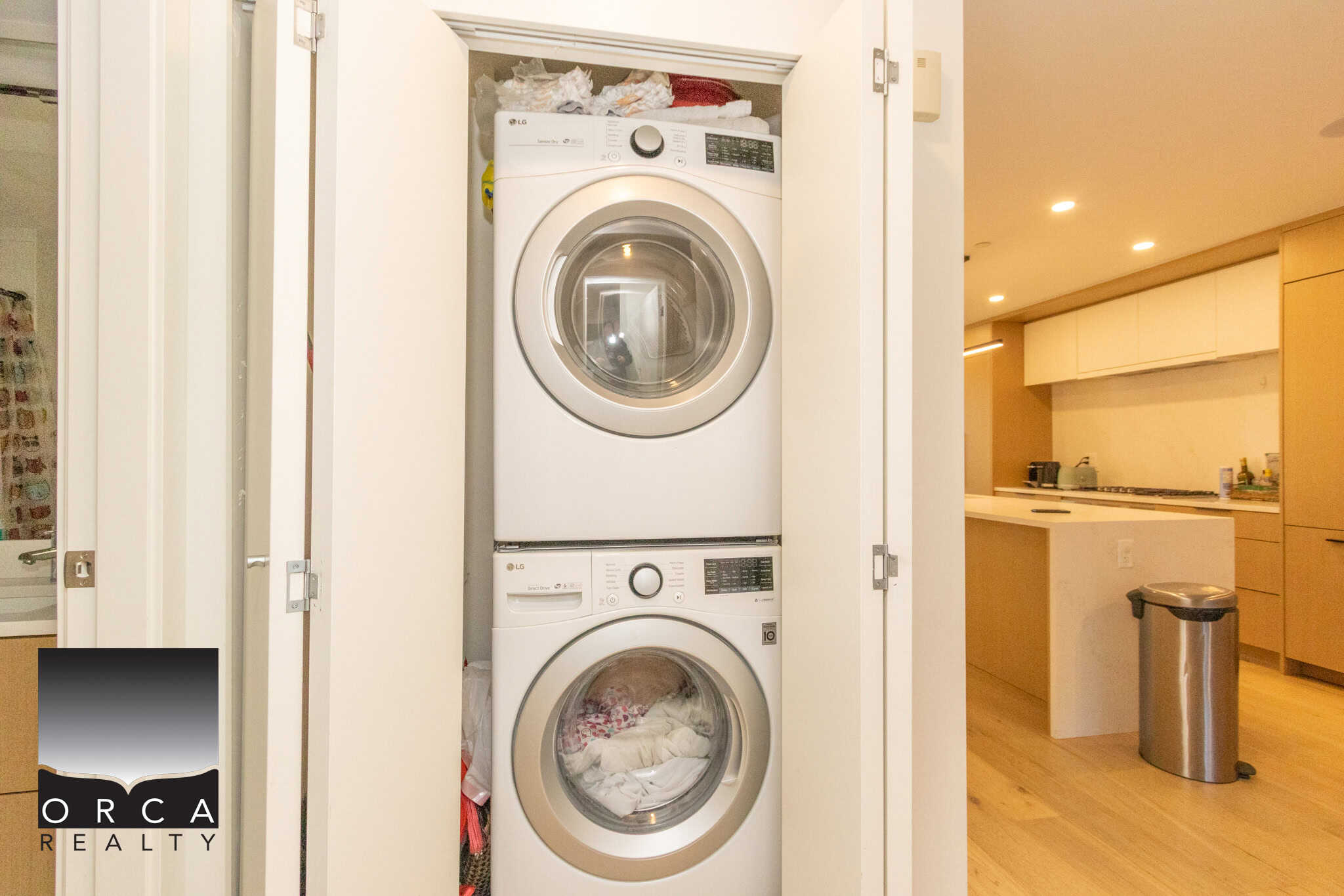 Laundry appliances in a compact closet in North Vancouver property.