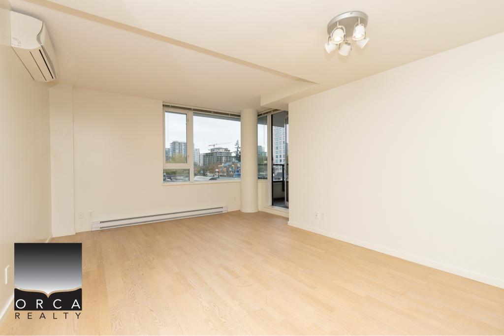 Bright, spacious downtown Vancouver condo with large windows, modern interiors, and a private balcony, ideal living space or investment property.