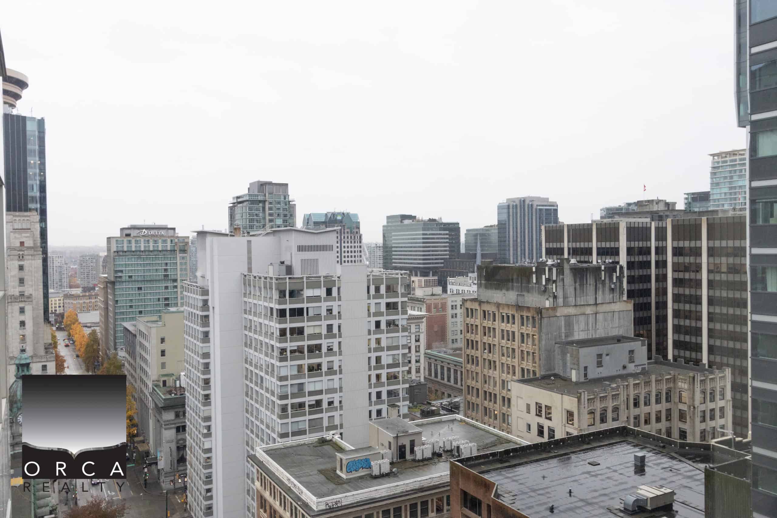 IMG_1761 Panoramic city skyline view from a high-rise apartment building in downtown Vancouver, British Columbia, showcasing commercial and residential buildings, perfect for real estate and property investment.