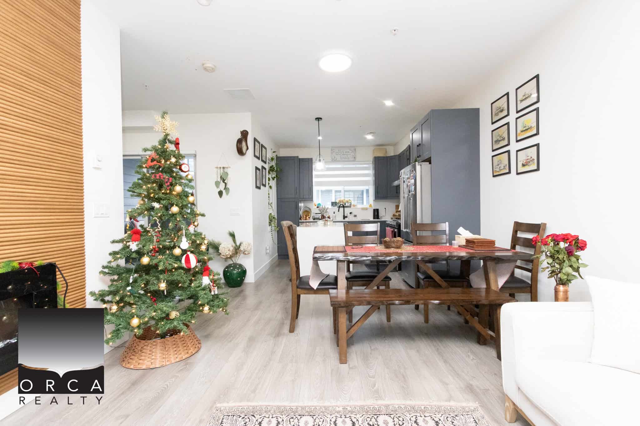 14 Cozy family home with open-concept living and dining area, modern kitchen, and Christmas decorations, ideal for buyers seeking comfortable, stylish real estate in Vancouver or surrounding areas.