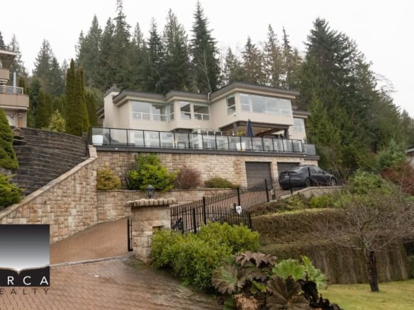 Luxurious modern Vancouver home with stunning mountain views, spacious outdoor deck, landscaped garden, and private driveway, perfect for upscale real estate in BC.