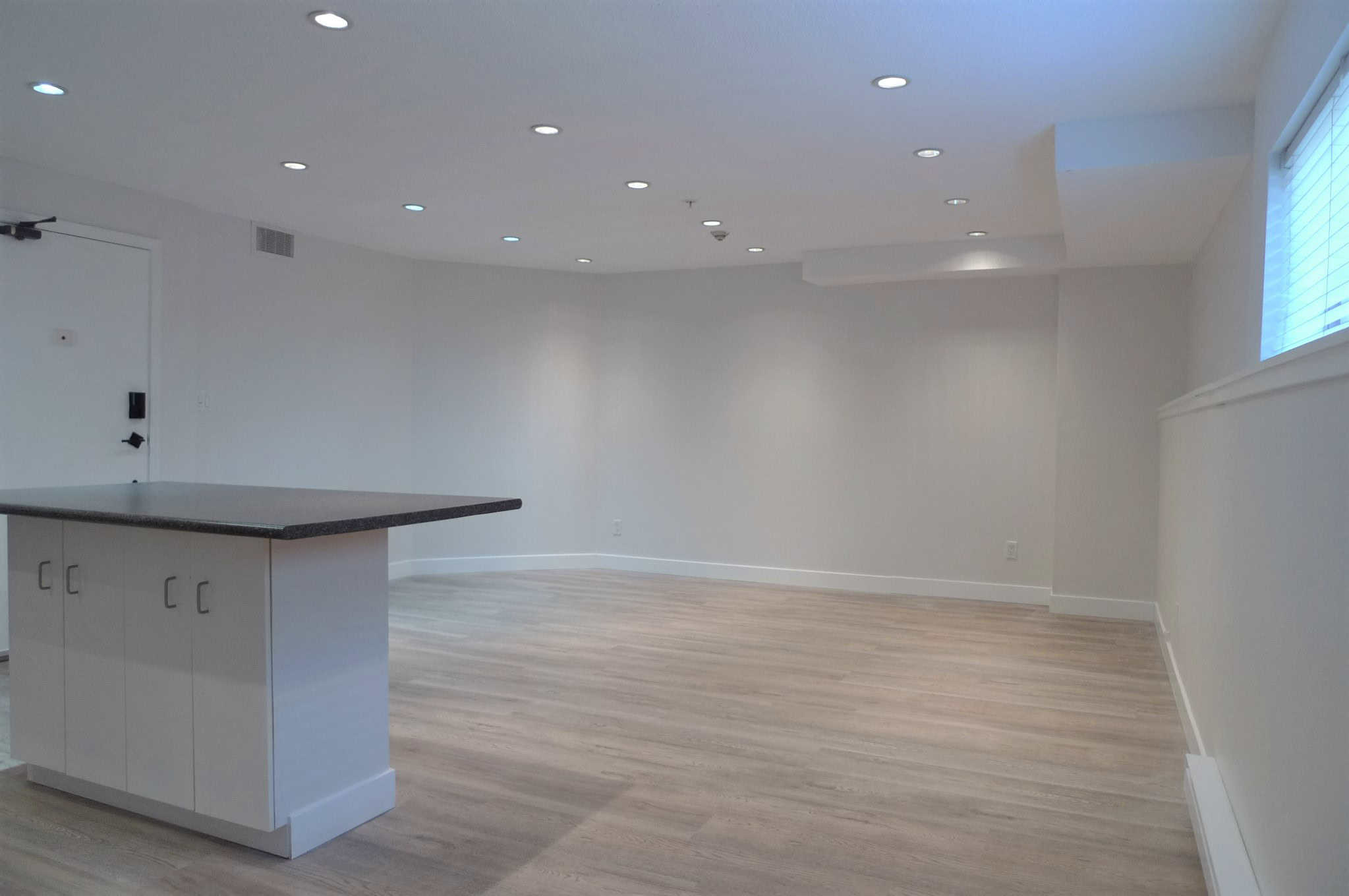 Bright open living space with modern design, clean white walls, and natural light, perfect for Vancouver real estate listings and showcasing desirable Vancouver condos.