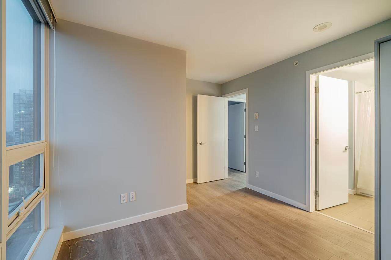 image8 Bright and modern residential interior with large windows, hardwood flooring, and neutral wall colours, perfect for a comfortable living experience.