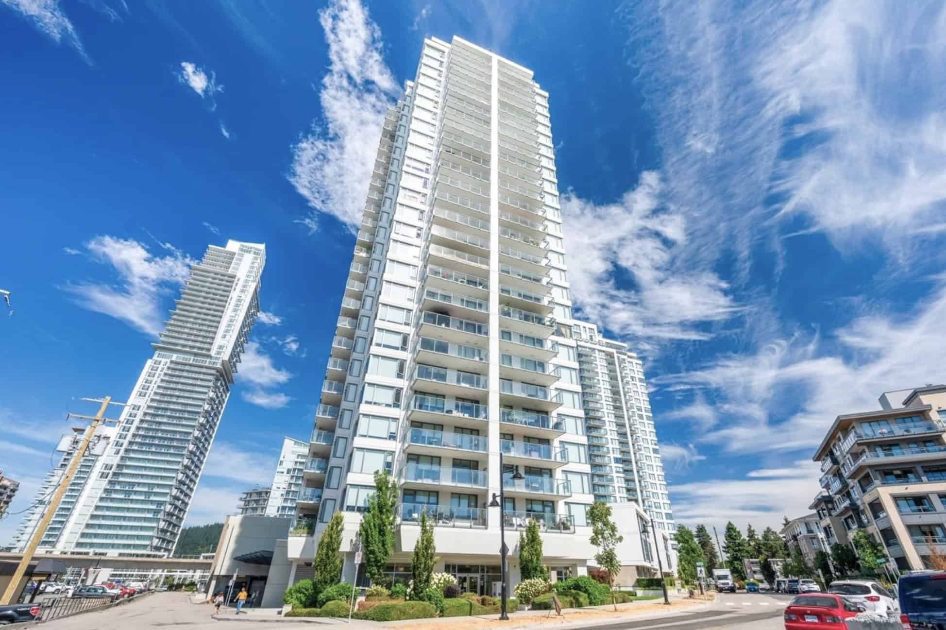 Luxurious high-rise condo building in downtown Vancouver showcasing modern architecture and waterfront lifestyle. Prime real estate by Orca Realty Inc., ideal for premium property investment.