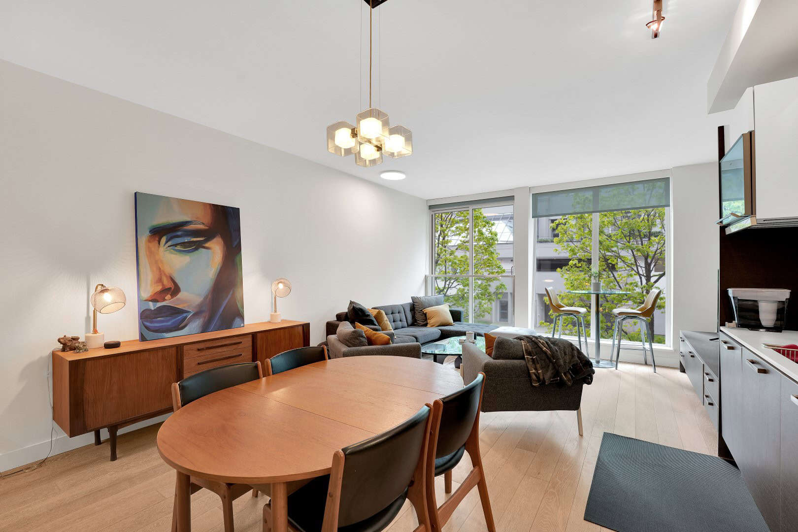 12 Bright modern living room in Vancouver with large windows, open-concept design, stylish furniture, and natural light - ideal for Vancouver real estate and condos.