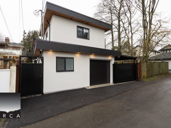 Modern custom-built house with sleek design in Vancouver, BC, showcasing contemporary architecture, stylish exterior, and prime real estate options by Orca Realty Inc.