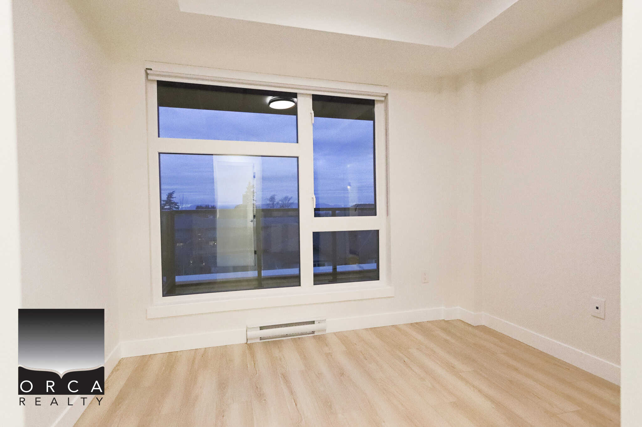 Bright empty bedroom with large window, natural light, modern interior, new home, orca realty, Vancouver real estate, residential property for sale in BC, apartment, condo, real estate listing, interior design.