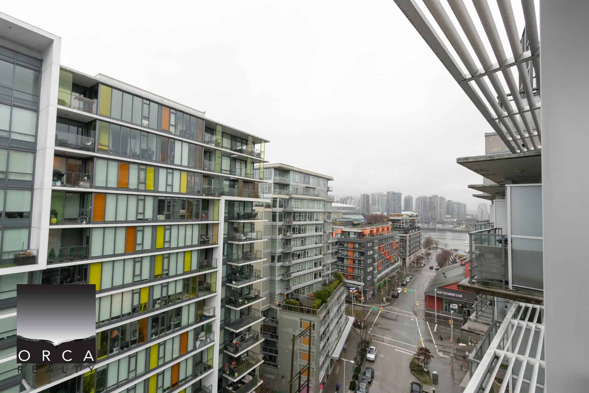 19 (3) Modern Vancouver cityscape with contemporary high-rise apartments and scenic waterfront views, showcasing the prime real estate opportunities offered by Orca Realty Inc.