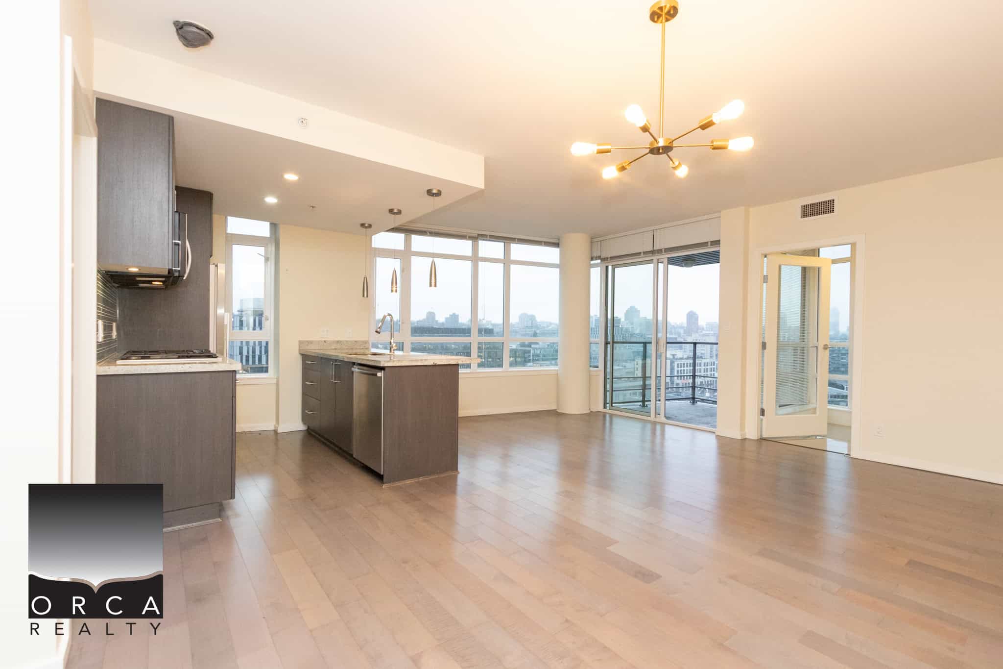 2 (6) Bright modern open-concept apartment with large windows, spacious living area, and updated kitchen in downtown Vancouver, ideal for urban living.