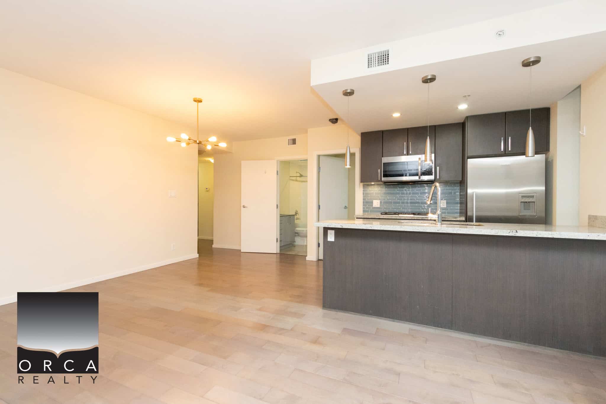 20 (3) Modern beachfront condo interior with open living space, stylish kitchen, and contemporary finishes, ideal for luxury Vancouver Island real estate.