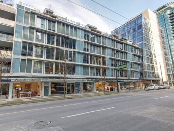 Modern downtown Vancouver high-rise building with retail shops and offices, showcasing innovative glass architecture and urban commercial real estate opportunities, ideal for investors and tenants.