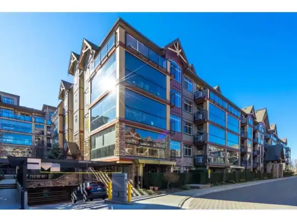Stunning modern apartment building in Vancouver with extensive glass facades, perfect for luxury real estate in British Columbia.