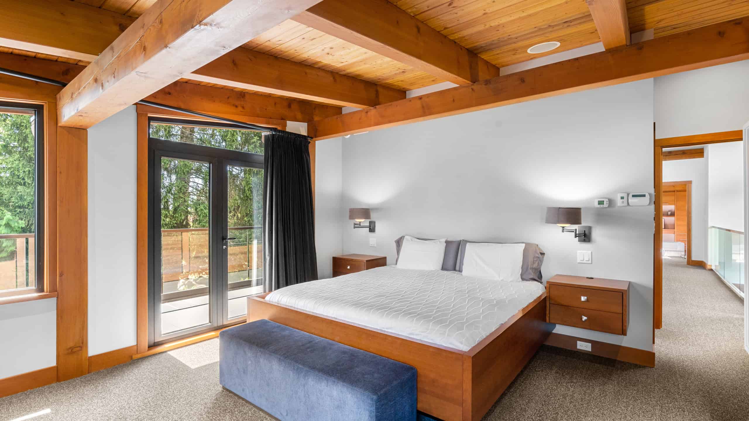 Luxury Bedroom with Scenic Views Elegant bedroom featuring large windows and modern decor in West Vancouver. Perfect for a comfortable stay at 865 Andover Crescent.