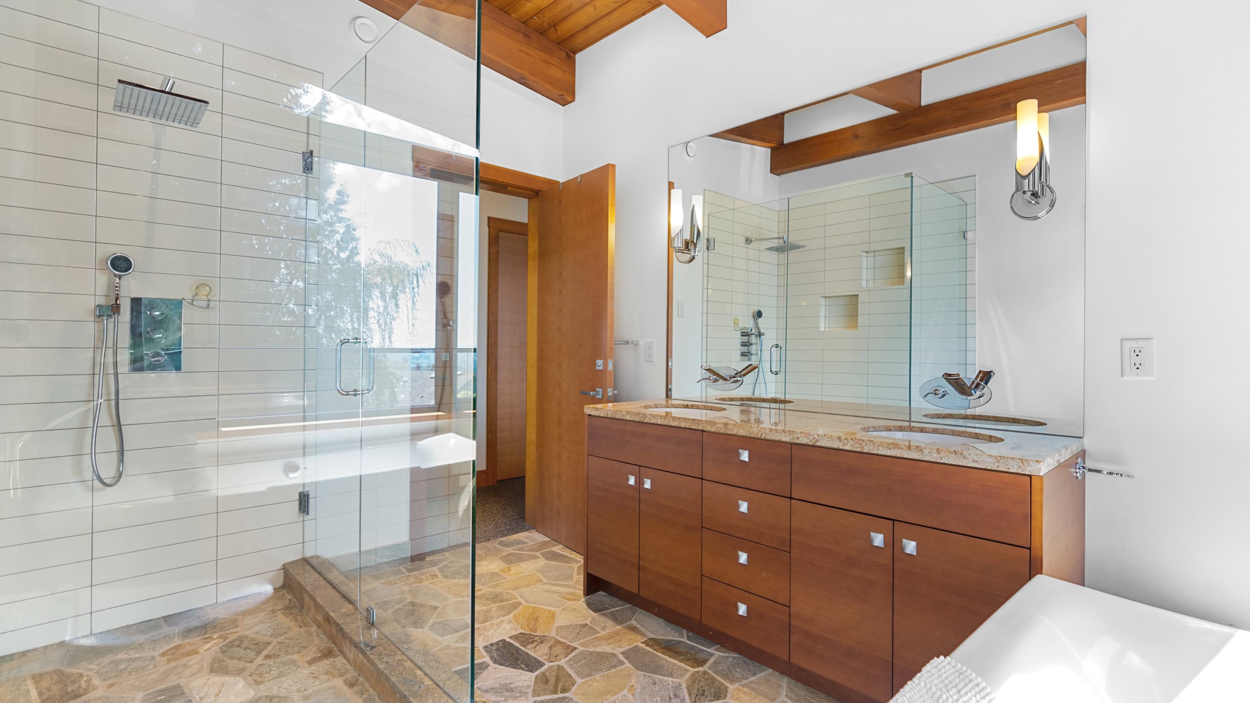 Modern West Vancouver Bathroom with Walk-In Shower and Double Vanity Bright West Vancouver bathroom featuring a spacious walk-in shower with glass enclosure, stylish double vanity, and natural wood accents, ideal for luxury home living.