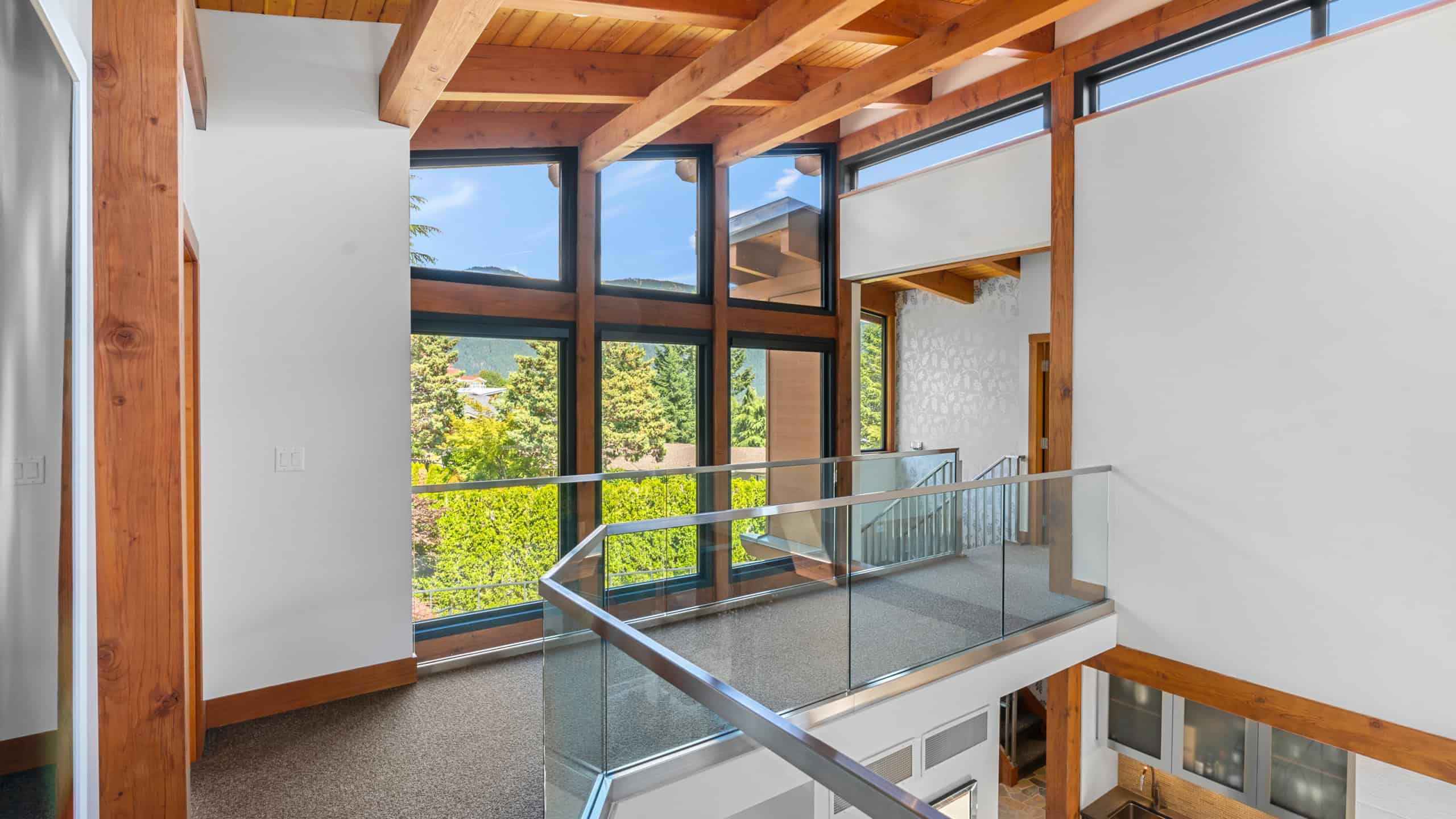 Modern West Vancouver Home Interior Bright interior view of a contemporary West Vancouver residence with large windows and wooden accents.
