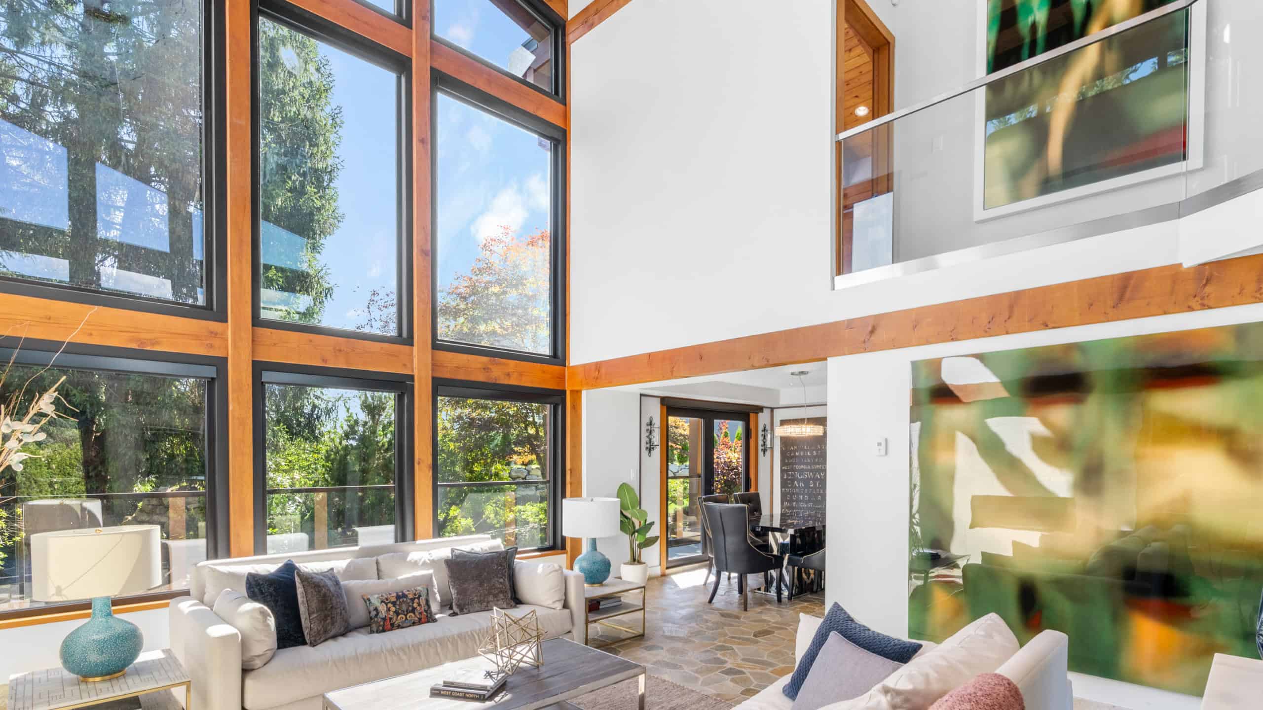 Luxury West Vancouver Home Interior Elegant living room with floor-to-ceiling windows and modern decor in West Vancouver. Bright, spacious, and perfect for family gatherings or entertaining guests.