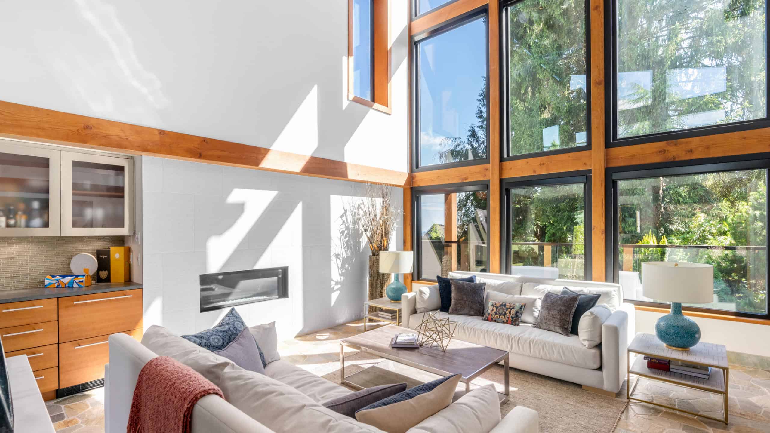 Modern West Vancouver Home Interior with Floor-to-Ceiling Windows Bright and spacious living room in West Vancouver featuring large windows, contemporary furniture, and natural light, showcasing luxury real estate at 865 Andover Crescent.