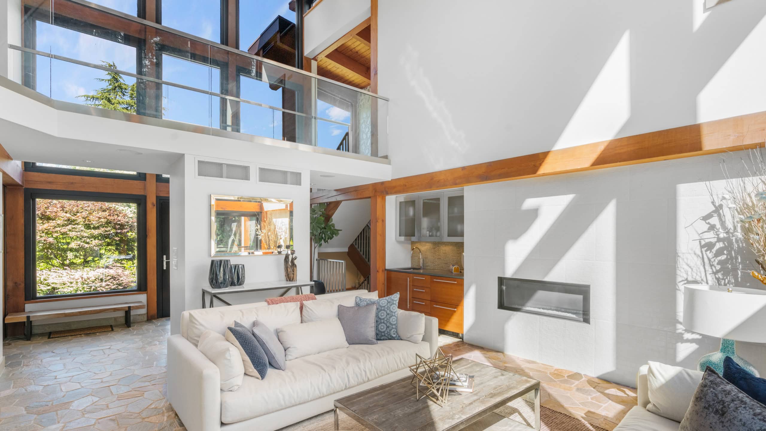 Modern West Vancouver Home Interior Bright, spacious living room in West Vancouver with high ceilings and large windows.