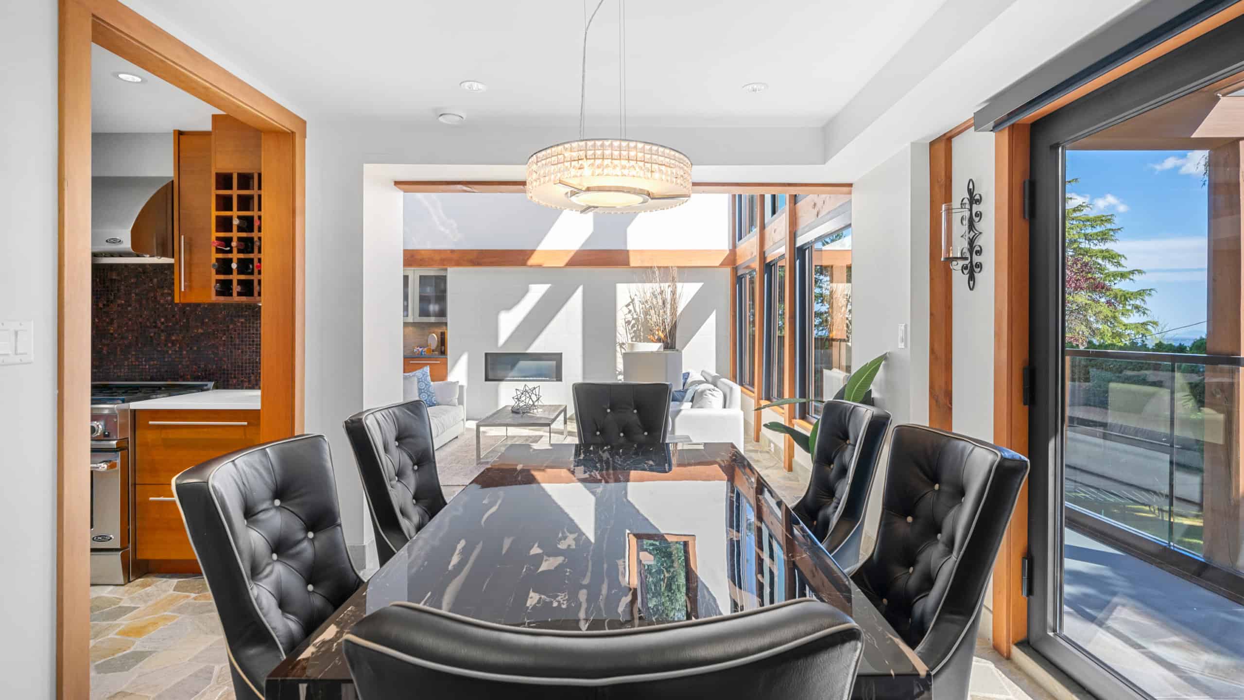 Modern West Vancouver Home Interior Elegant dining area in a contemporary West Vancouver residence with large windows and stylish decor.