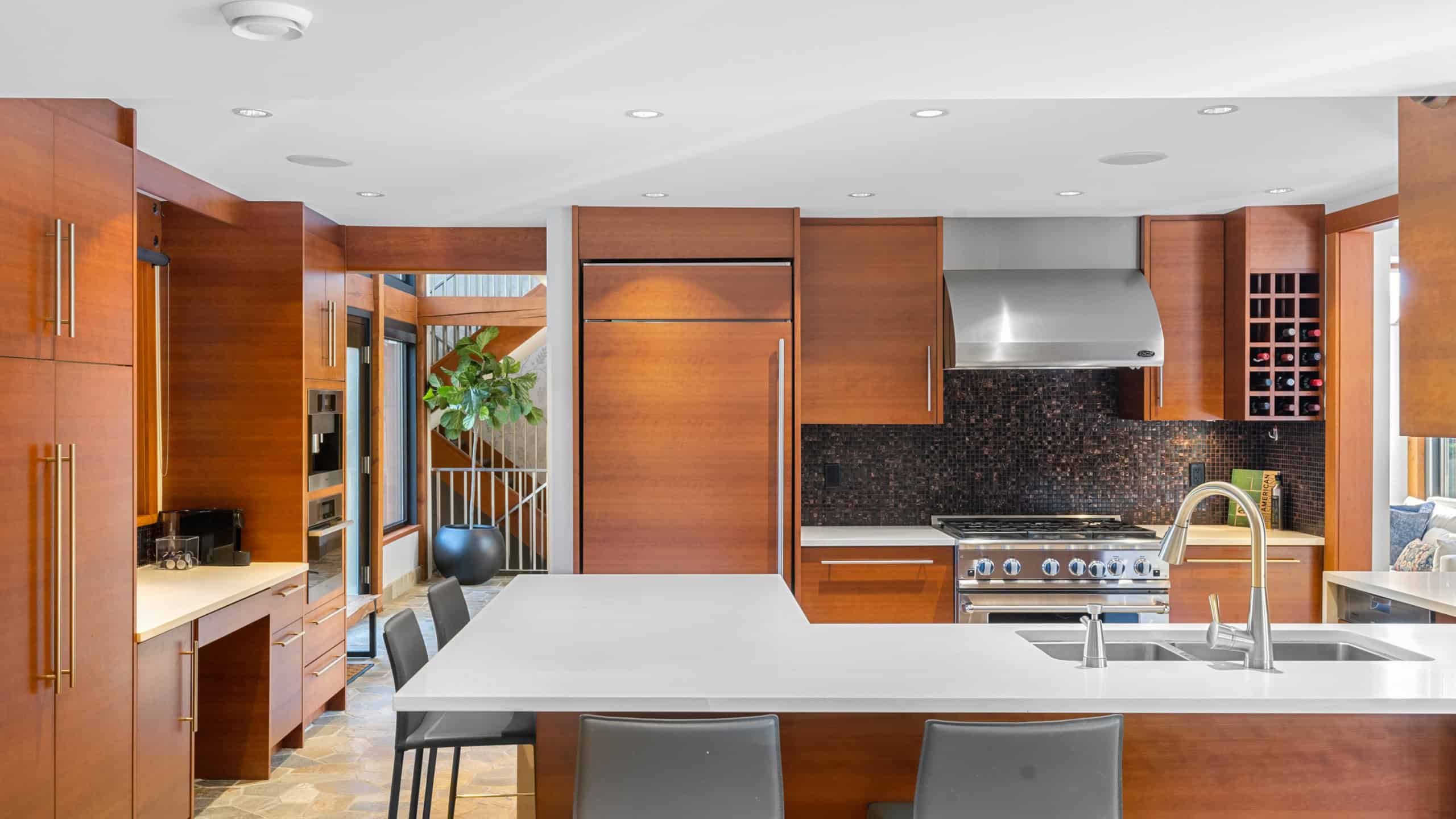 865 Andover Crescent West Vancouver Modern kitchen with wooden cabinetry and stainless steel appliances in West Vancouver home.