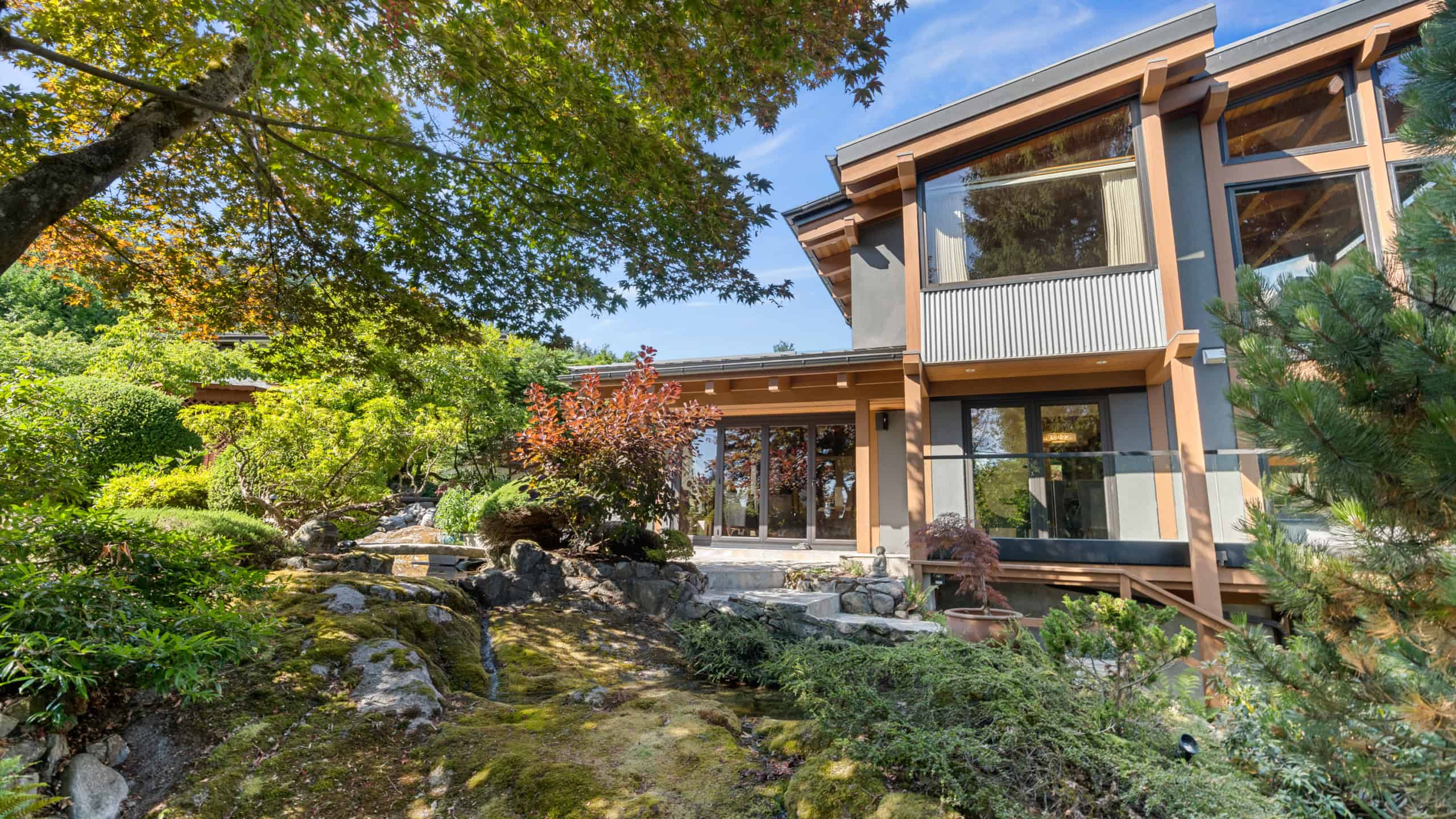 Modern West Vancouver Home with Lush Garden Views Beautiful contemporary house in West Vancouver surrounded by vibrant greenery and landscaped gardens, showcasing elegant architecture and scenic outdoor spaces.