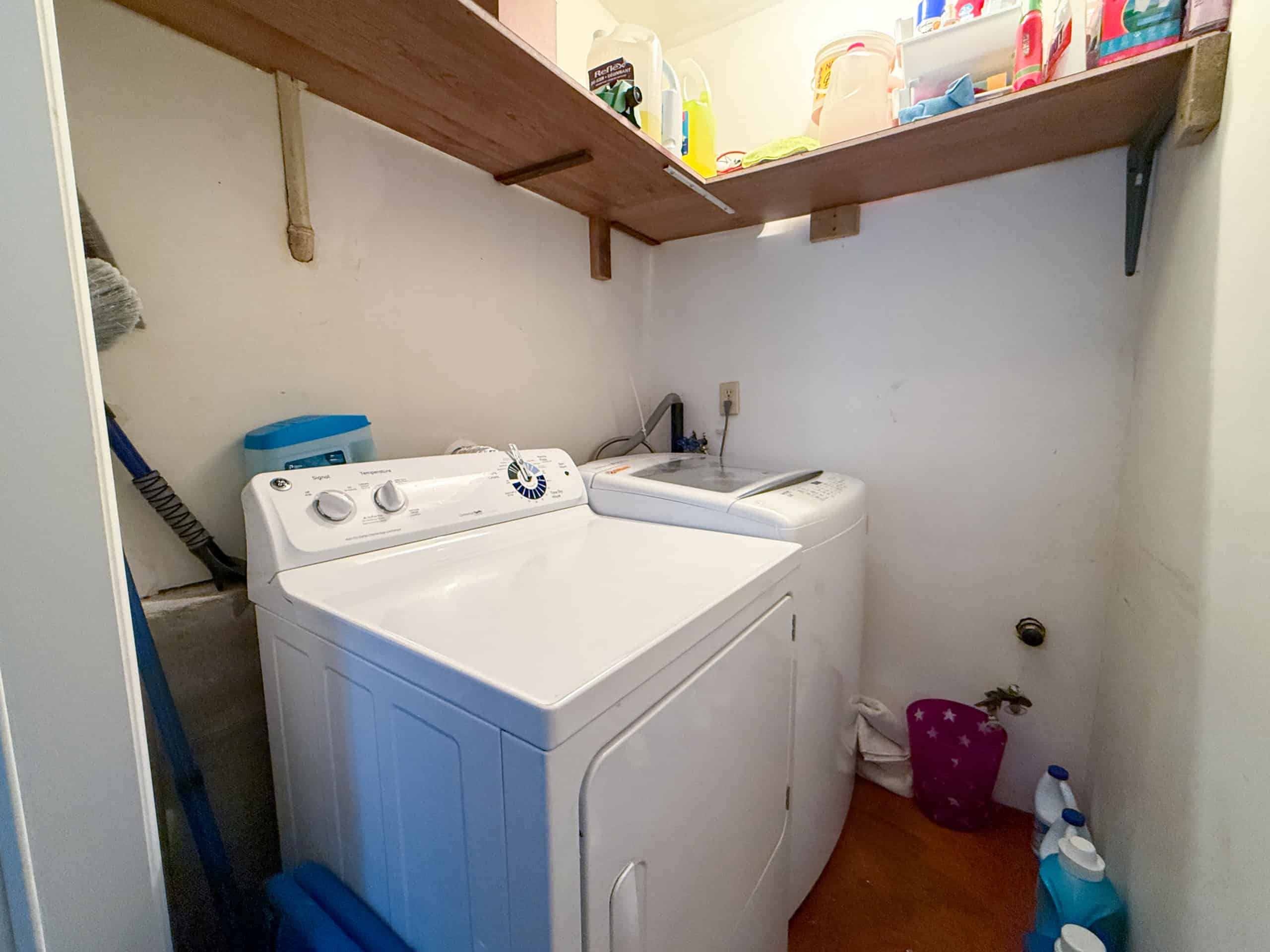 Bright laundry area with washer and dryer in North Vancouver home.