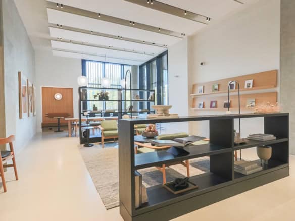 Contemporary real estate office interior with modern decor, natural lighting, and stylish furniture, representing Orca Realty Inc.'s professional property services and client-focused approach in BC.