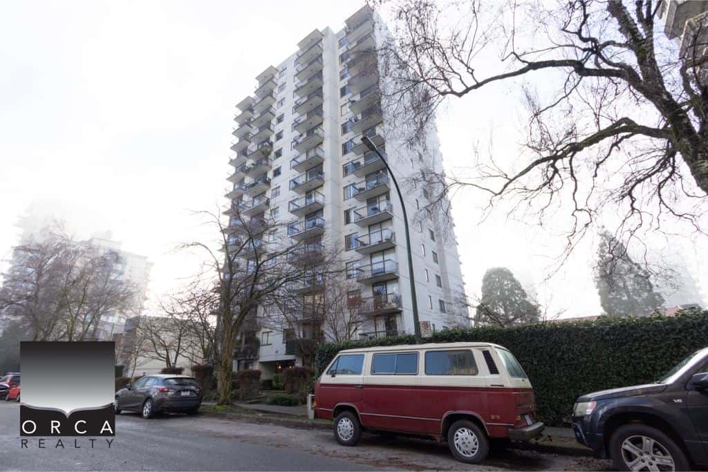 Modern high-rise residential building with a lively cityscape and parking area, ideal for Vancouver property investment and real estate opportunities.