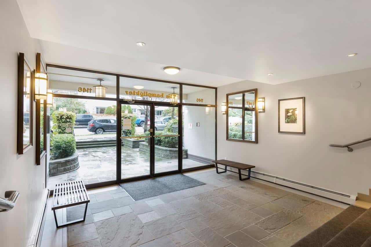 Bright welcoming lobby of Orca Realty Inc. featuring modern lighting, glass doors, and stylish decor, perfect for clients seeking local real estate services in British Columbia.