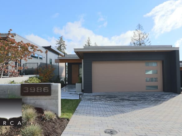Contemporary West Vancouver residence at 3986 Uplands Way with sleek design and spacious garage. Perfect for luxury living in a prime location.