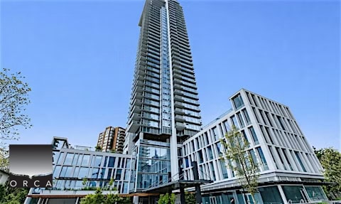 Bright, high-rise condominium building located at 1106-4360 Beresford Street in Vancouver, showcasing contemporary architecture and urban living in a vibrant neighborhood.