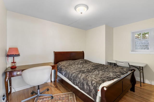 Affordable West Vancouver bedroom with simple decor and natural light.