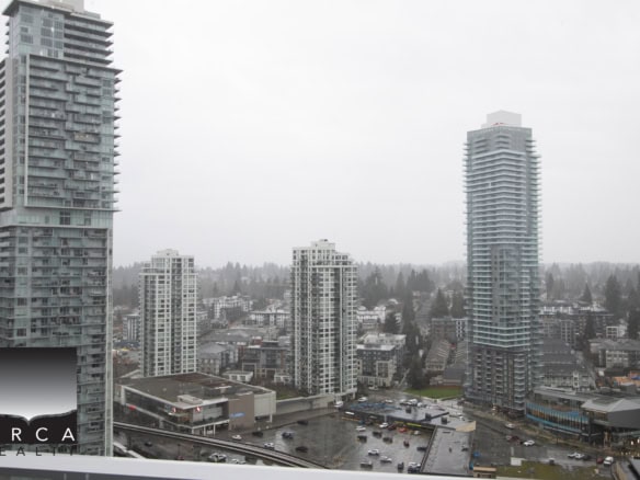 Panoramic view of Coquitlam cityscape featuring tall residential and commercial towers near 720 Farrow Street.