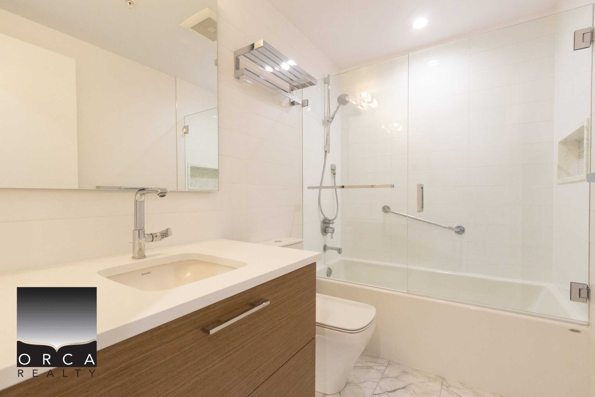 Contemporary bathroom featuring a walk-in shower, white tiles, and modern fixtures, perfect for a Vancouver home at 1106-4360 Beresford Street.
