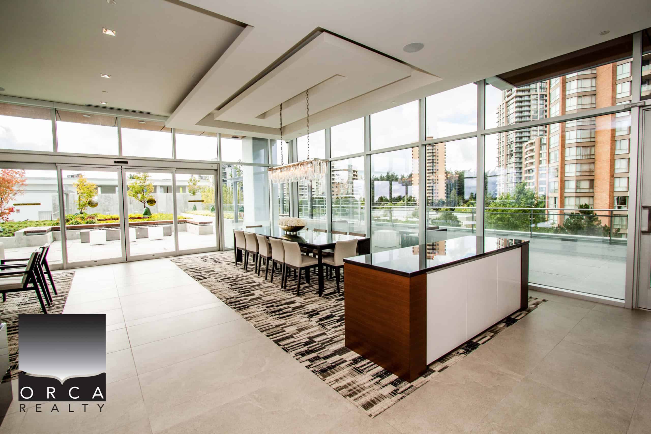 Spacious condo living room in Vancouver with large windows, contemporary design, and scenic cityscape views, perfect for modern urban lifestyles.