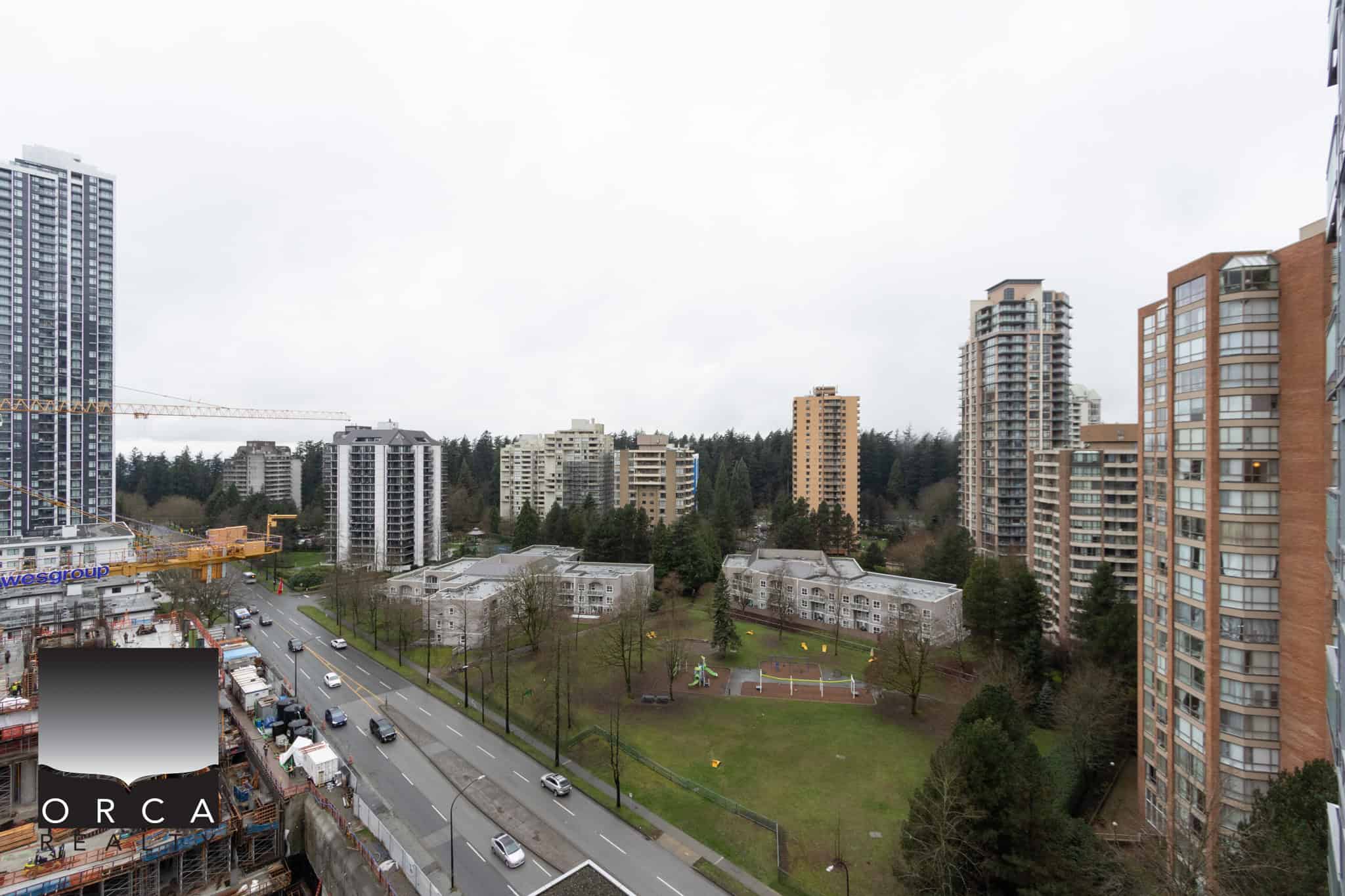 Vancouver cityscape with residential high-rises and green parkland at Beresford Street, showcasing urban living and natural surroundings in the 1106-4360 Beresford Street area.