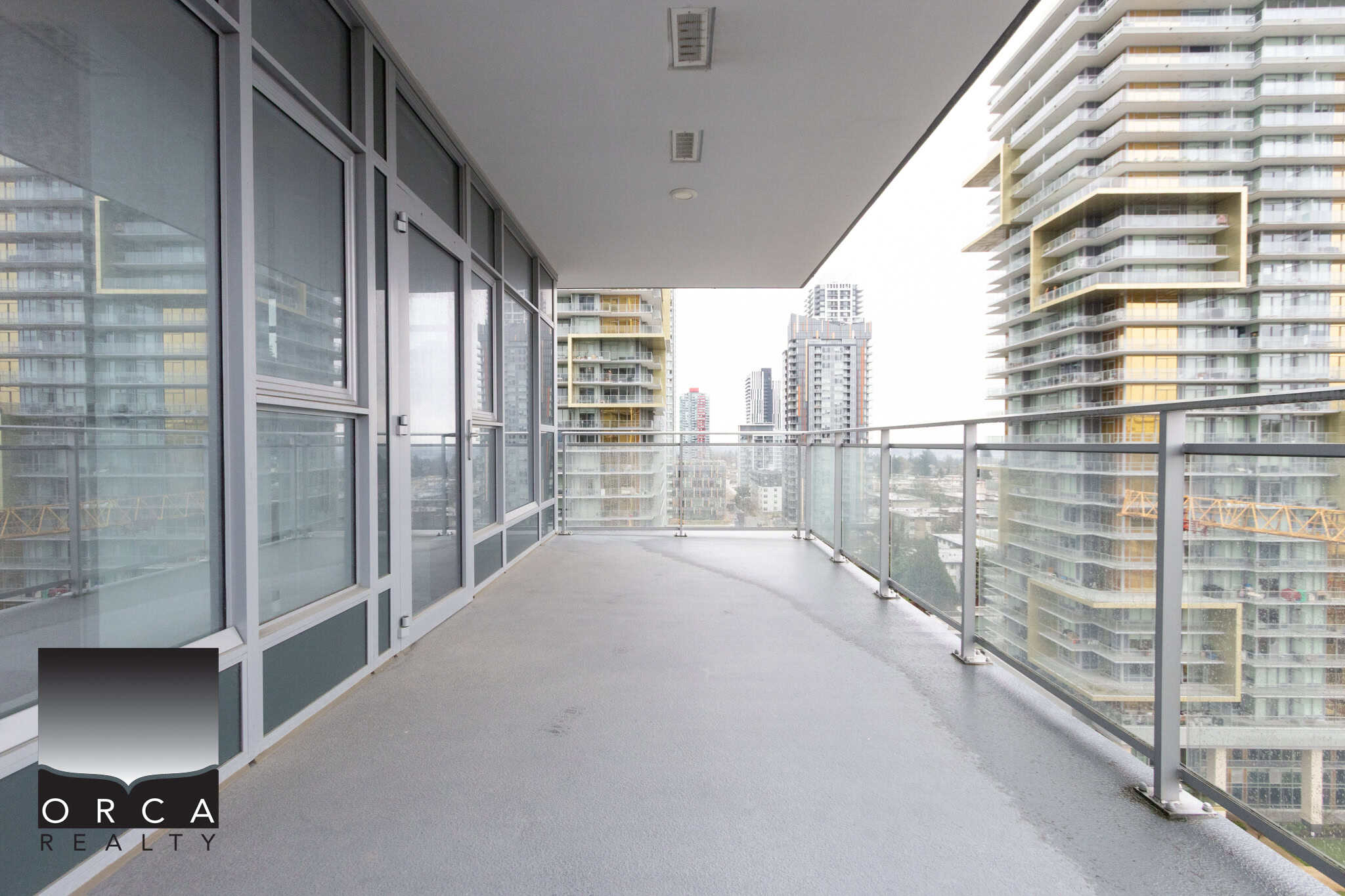 Spacious balcony in Vancouver's 1106-4360 Beresford Street, offering stunning city views and outdoor living space. Perfect for relaxing or entertaining in a vibrant urban setting.