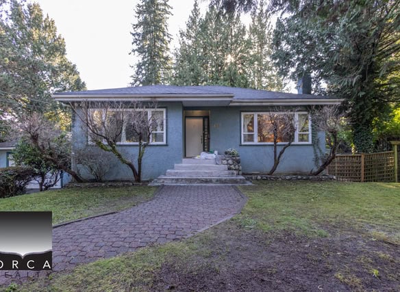 Bright and inviting West Vancouver residence with lush landscaping and a paved walkway. Perfect for families seeking a peaceful neighborhood close to amenities.