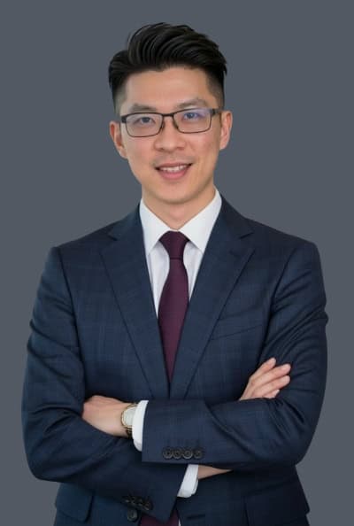 Vancouver property management professional in a suit, representing Orca Realty Inc., specializing in residential and commercial property management services in Vancouver.