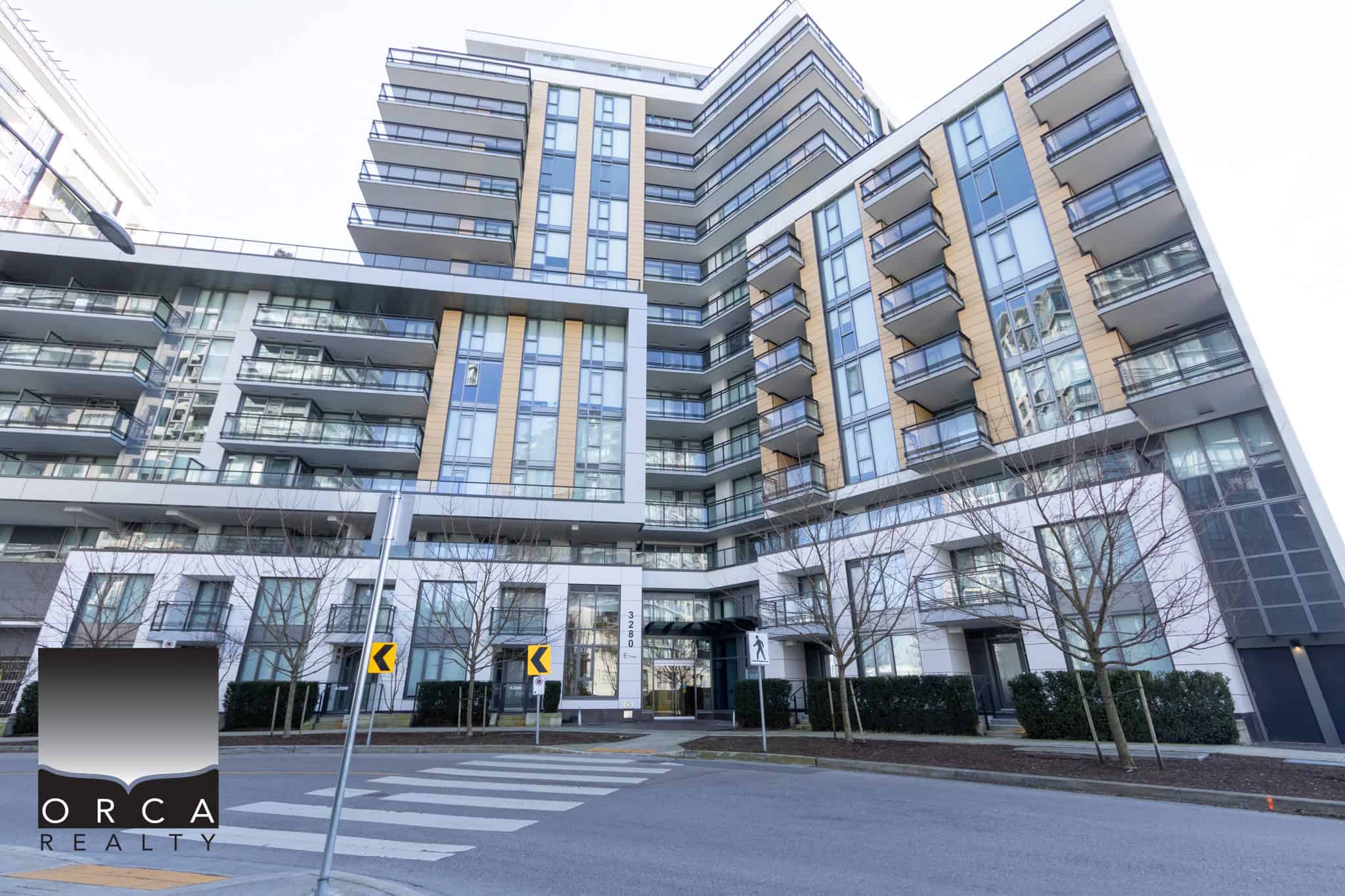 Contemporary multi-storey residential building in Richmond with glass balconies and urban design, located at 702E-3280 Corvee Way.