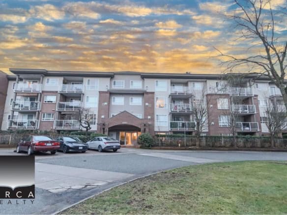 Spacious multi-unit residential complex at 410-15895 84th Ave, Surrey, featuring balconies and parking.
