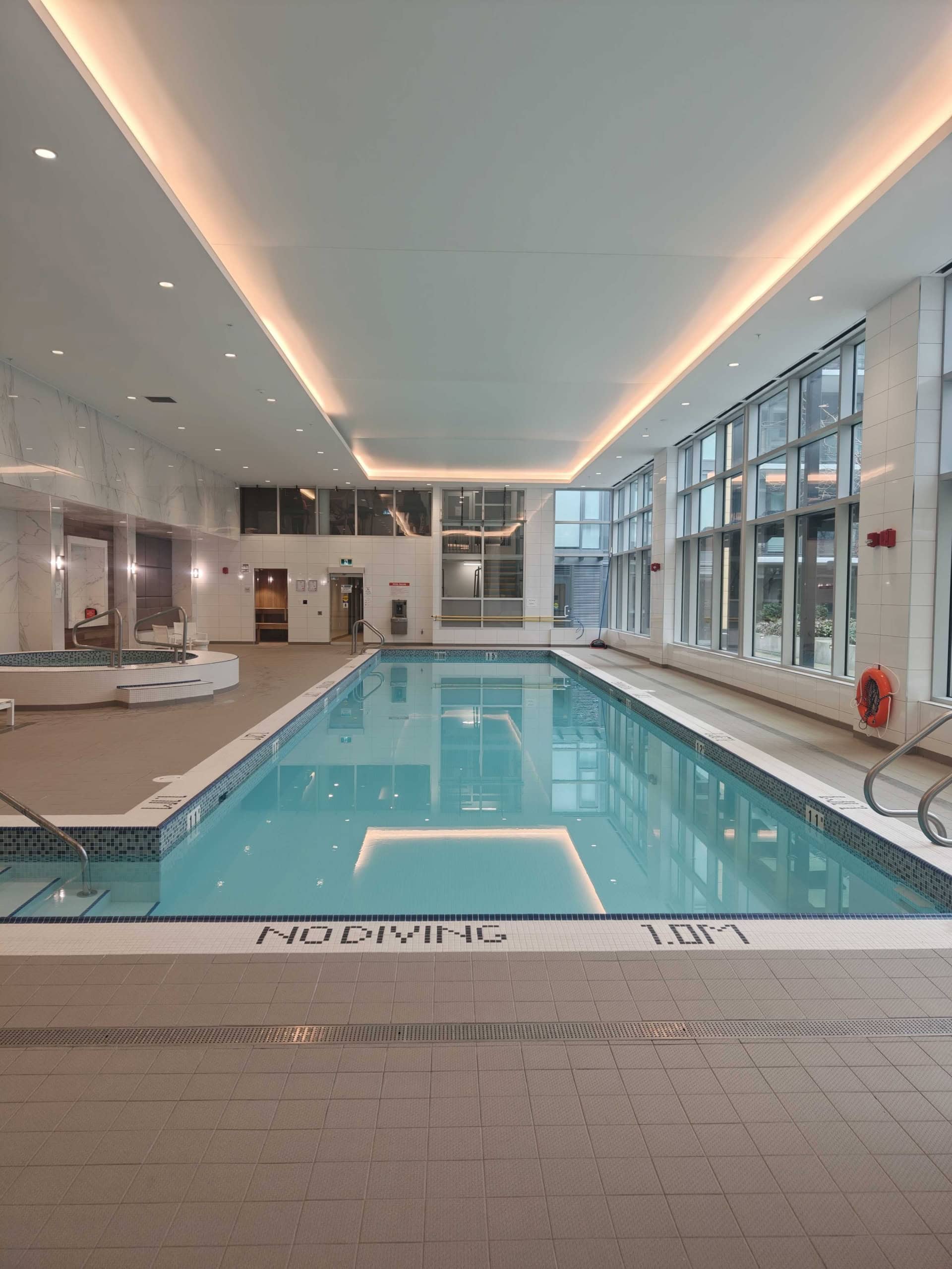 Indoor swimming pool at Orca Realty Inc. property, 702E-3280 Corvee Way, Richmond. Modern, bright, and spacious with large windows, perfect for relaxation and fitness. Indoor swimming pool at Orca Realty Inc. property, 702E-3280 Corvee Way, Richmond. Modern, bright, and spacious with large windows, perfect for relaxation and fitness.