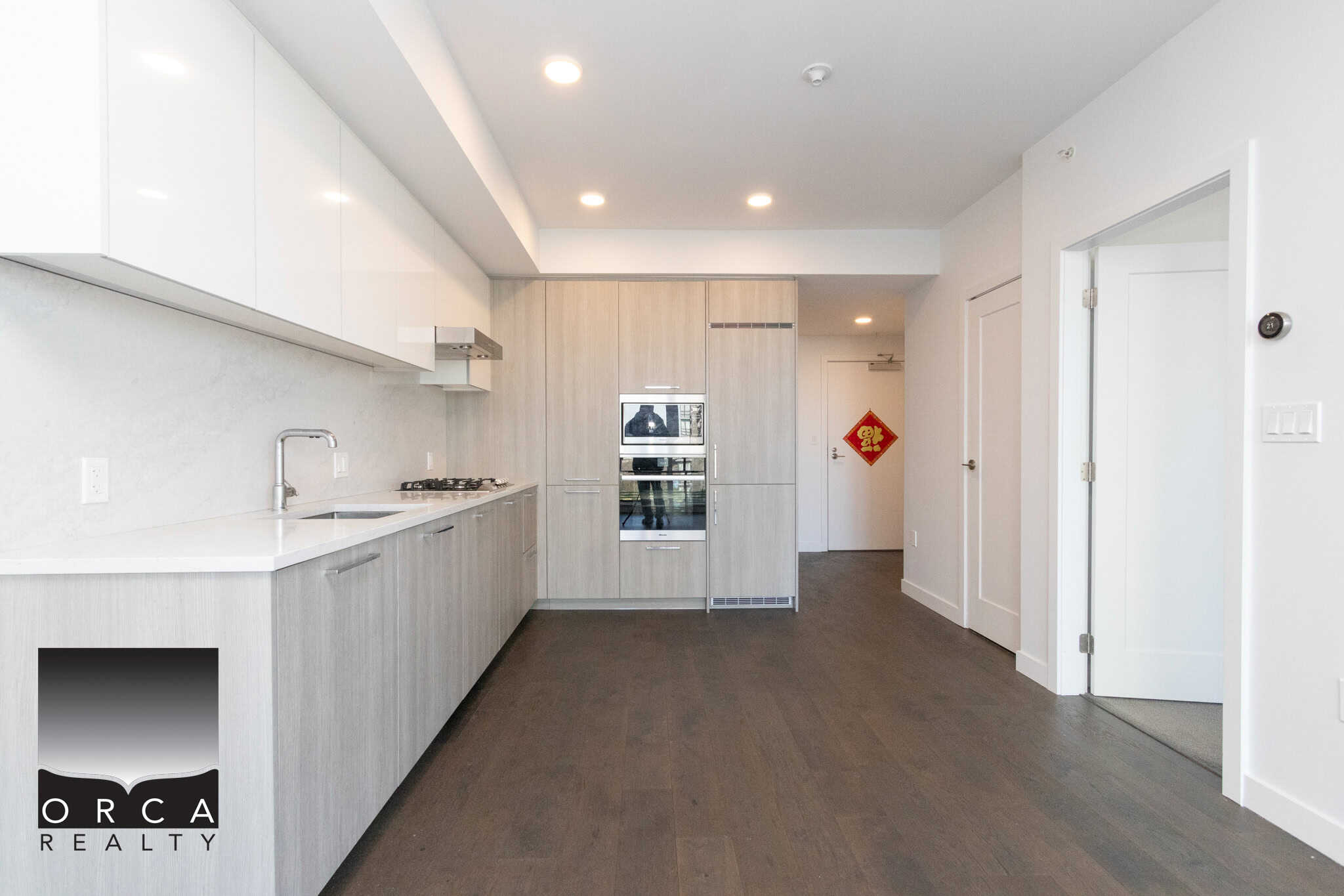Modern Kitchen in Richmond Condo Bright, contemporary kitchen with white cabinetry and stainless steel appliances in Richmond. Perfect for modern living and entertaining.