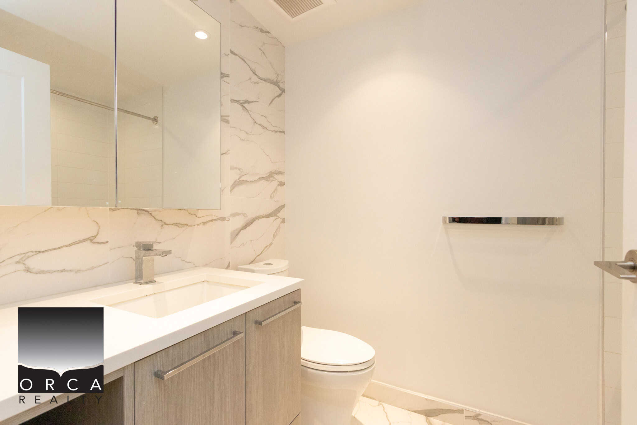 Modern Bathroom with Marble Accents Contemporary bathroom featuring marble walls, sleek vanity, and modern fixtures in a new Richmond home. Perfect for luxury living.