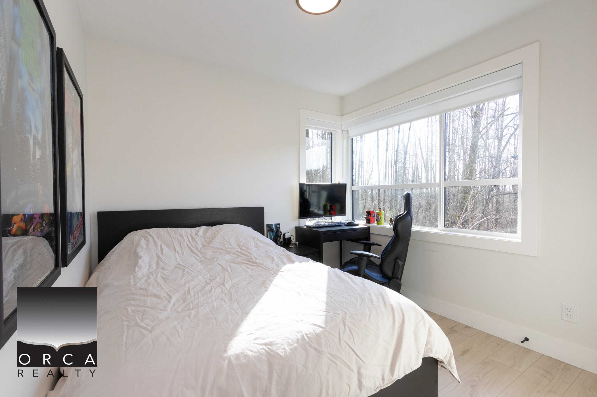 Bright bedroom with large windows in Langley property at 75A Avenue.