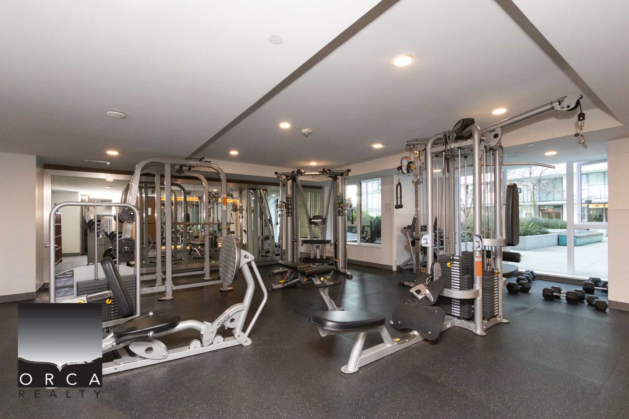 Modern Fitness Center at 702E-3280 Corvee Way, Richmond Well-equipped gym with various exercise machines and weights at 702E-3280 Corvee Way, Richmond, offering residents a convenient fitness facility.