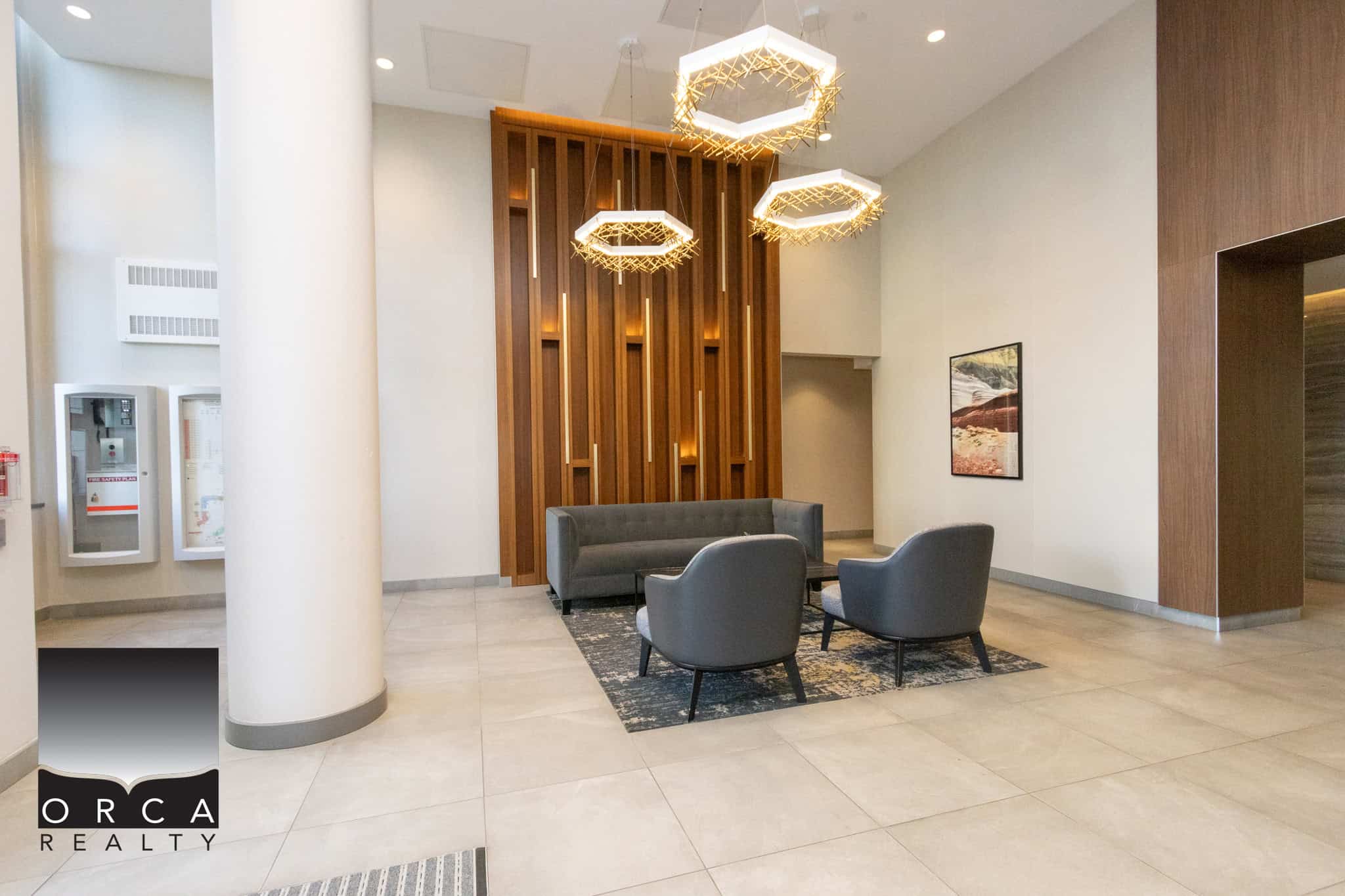 Modern Lobby at Orca Realty Office Elegant real estate office lobby with contemporary lighting and stylish seating in Richmond.