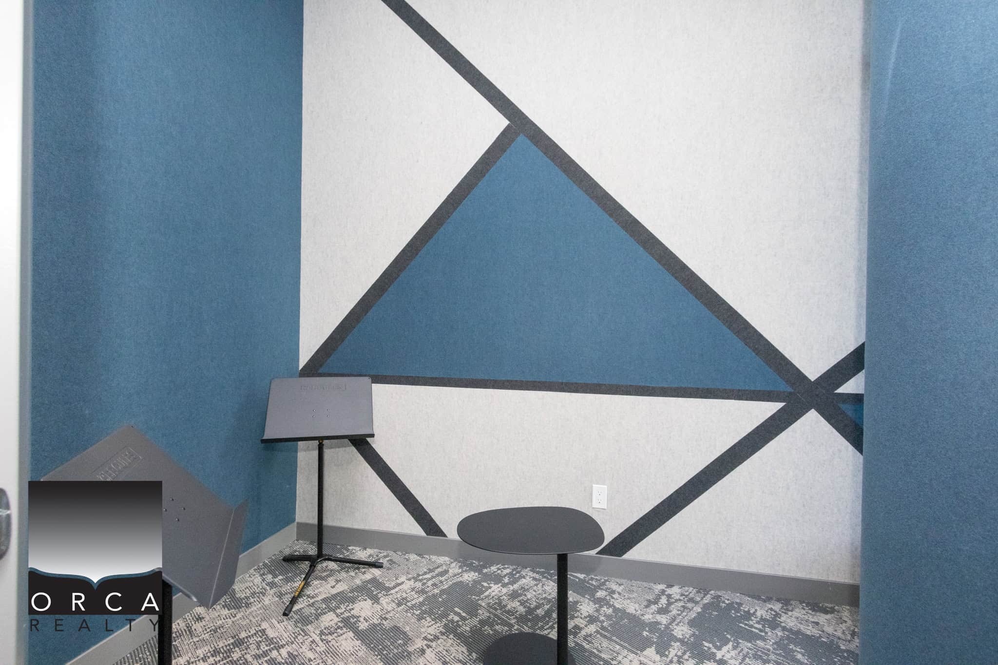 Modern interior design with geometric wall art in Richmond home Bright, stylish living space featuring bold geometric wall decor and contemporary furniture in Richmond, BC. Perfect for modern real estate listings showcasing upscale interiors.