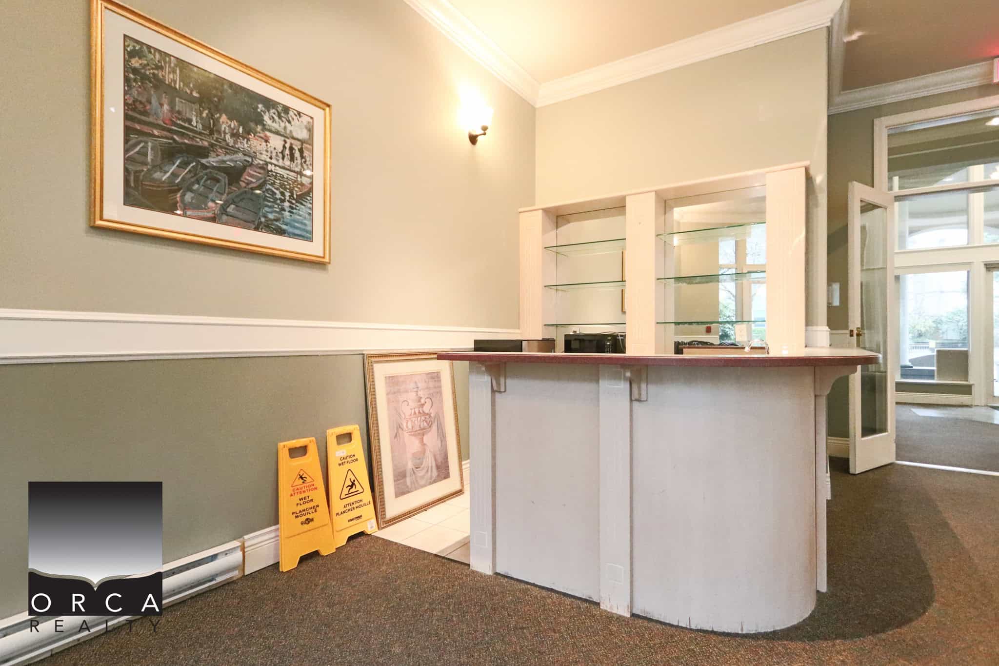 Affordable office space at 202-1185 Pacific St, Coquitlam, ideal for small businesses or real estate offices. Bright interior with welcoming reception area and ample natural light.